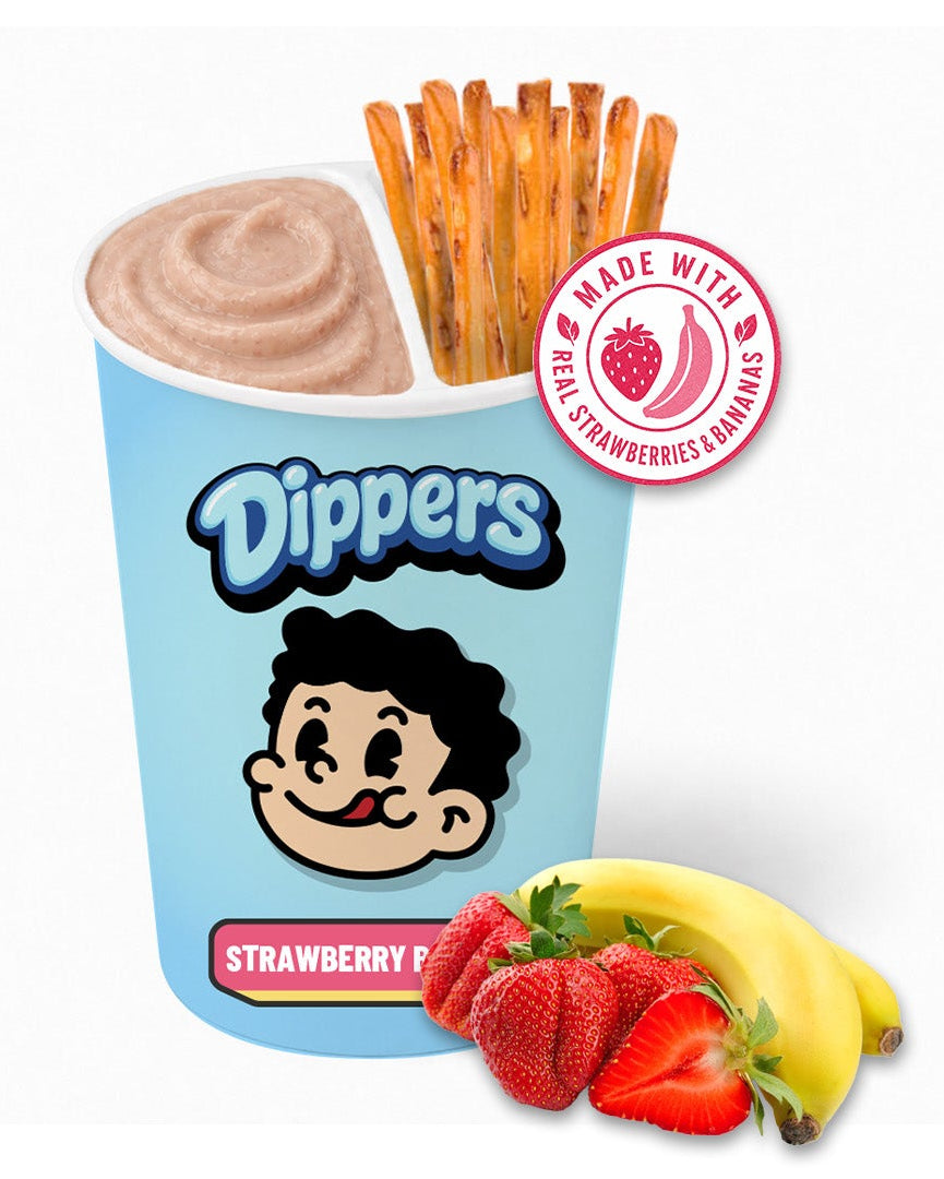 A Dippers Strawberry Fudge cup with a light blue container, chocolate-dusted waffle sticks, strawberries, and bananas on a plain white background. A red circular badge on the upper right says 'Made with Real Strawberries'.